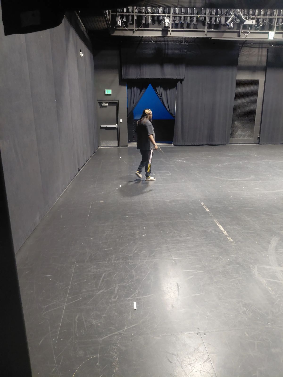 CJ Drisdom walking the Eccles Center stage during rehearsal